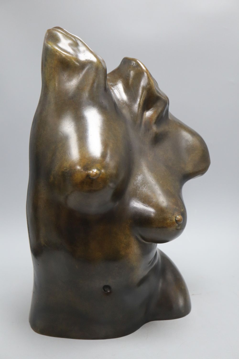 A bronze female torso, signed D. Claveric, height 47cm